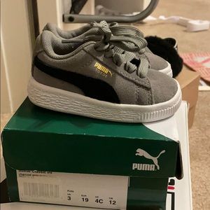 Black and grey Pumas